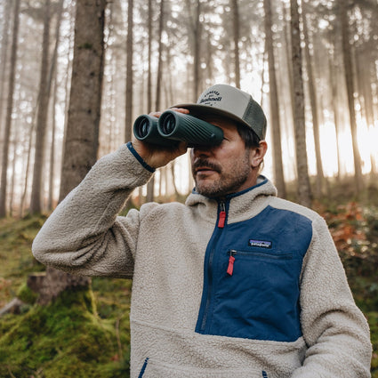 Man Holding Binocuars