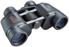 Front right view of black 7x35 binoculars with tasco logo in red on the left lens body and the focus knob