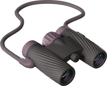 Textured Bushnell A1 10x25 binoculars in Plum Purple with an attached strap on a transparent background