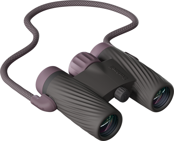 Textured Bushnell A1 10x25 binoculars in Plum Purple with an attached strap on a transparent background