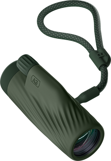 Bushnell A3 monocular in Laurel Green color with matching detachable wrist strap on a transparent background.