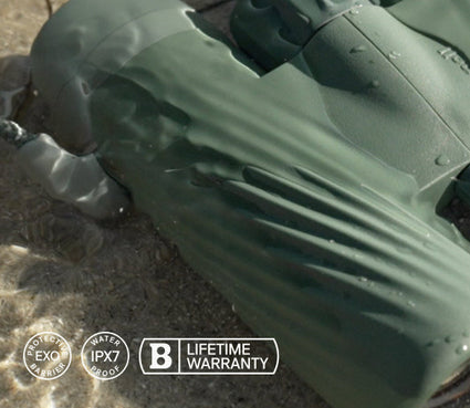 Green inflatable pool float on a sandy surface with brand logos visible.
