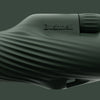Close-up of a cilantro green Bushnell A3 monocular on a green background