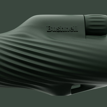 Close-up of a cilantro green Bushnell A3 monocular on a green background