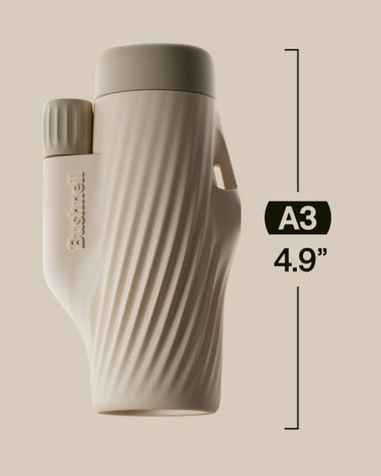 Beige binoculars with dimensions labeled on a beige background