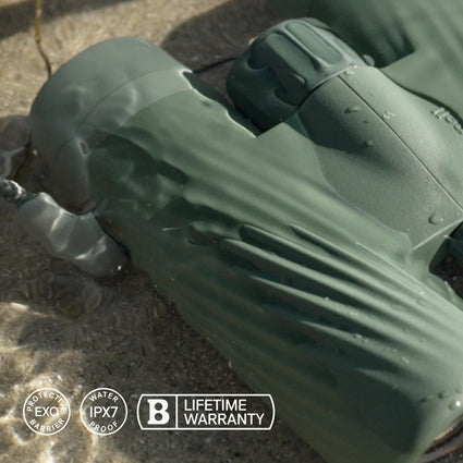 Green inflatable pool float on a sandy surface with brand logos visible.