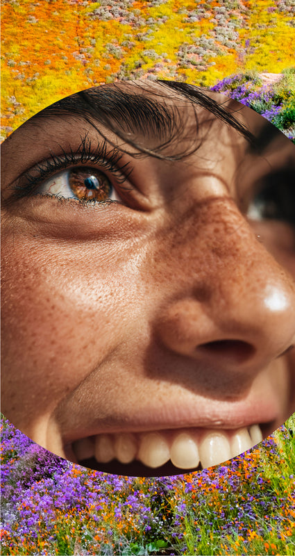Close-up of a person's face with a colorful floral background