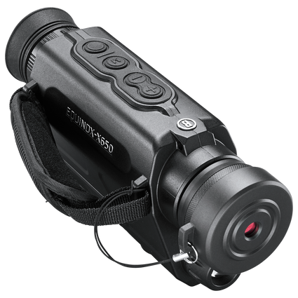 Front right view of Bushnell Equinox night vision monocular with lens cap on, set on a transparent background